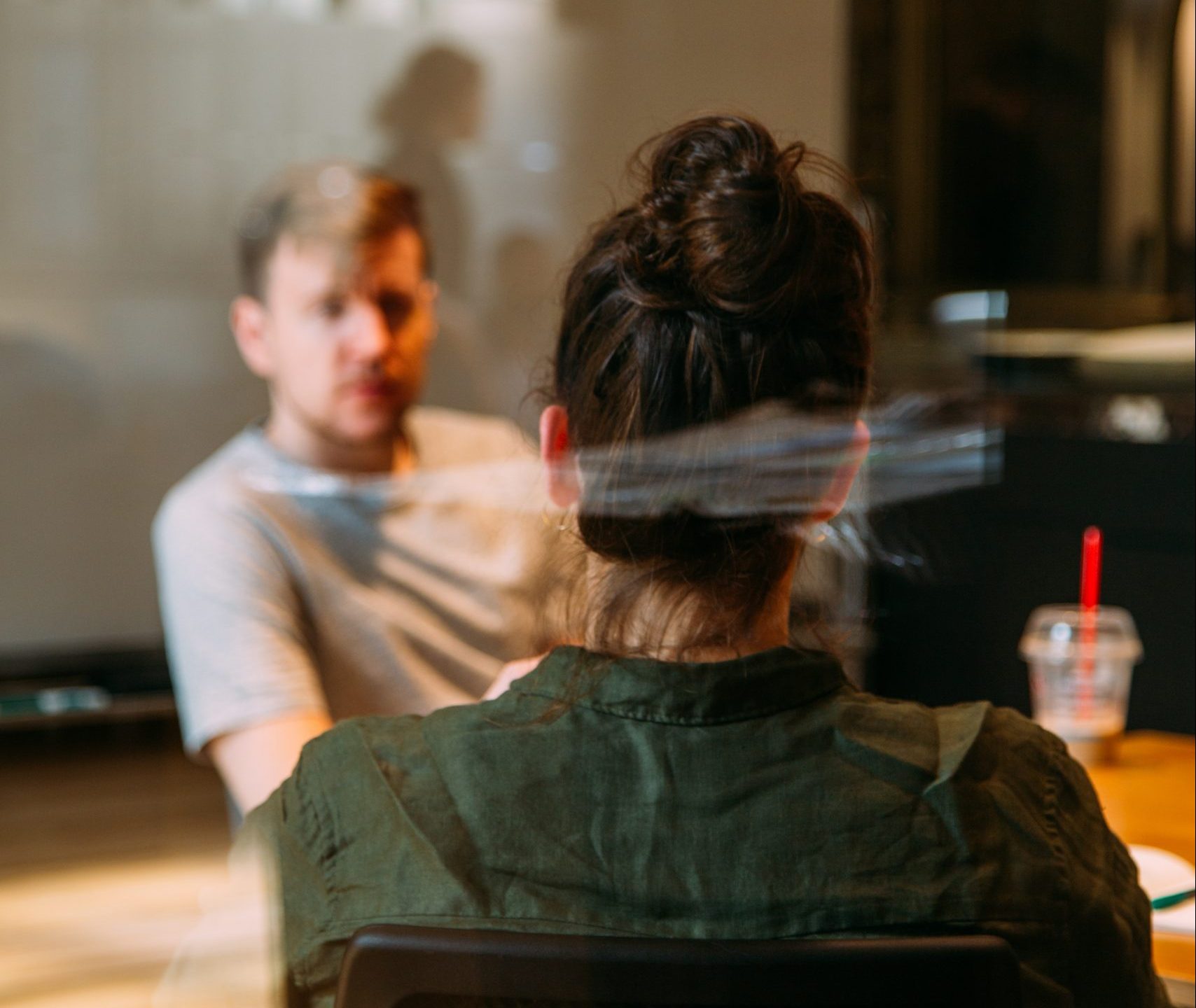 woman and man meeting across table